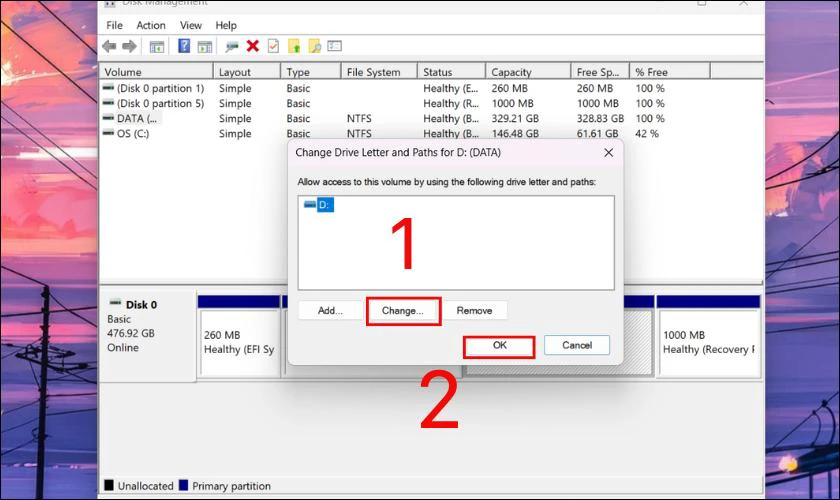 Bạn nhấp vào nút Change, đặt ký tự ổ đĩa mong muốn và ấn OK để lưu