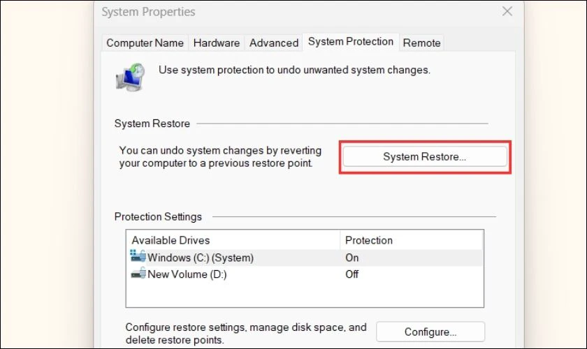 Ở System Properties, chọn System Restore...