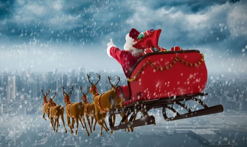 Tuần lộc và ông già Noel trong đêm tuyết rơi