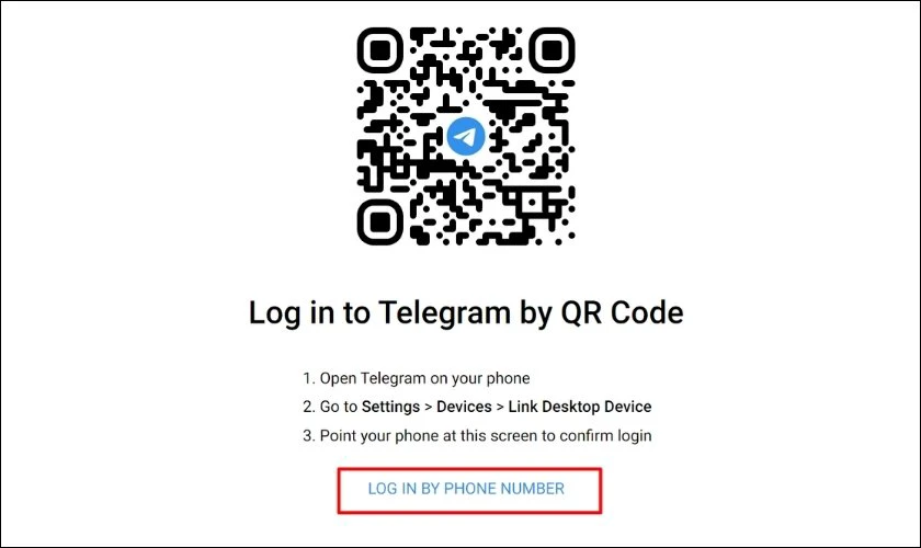 Chọn Log in by phone number trên Telegram máy tính