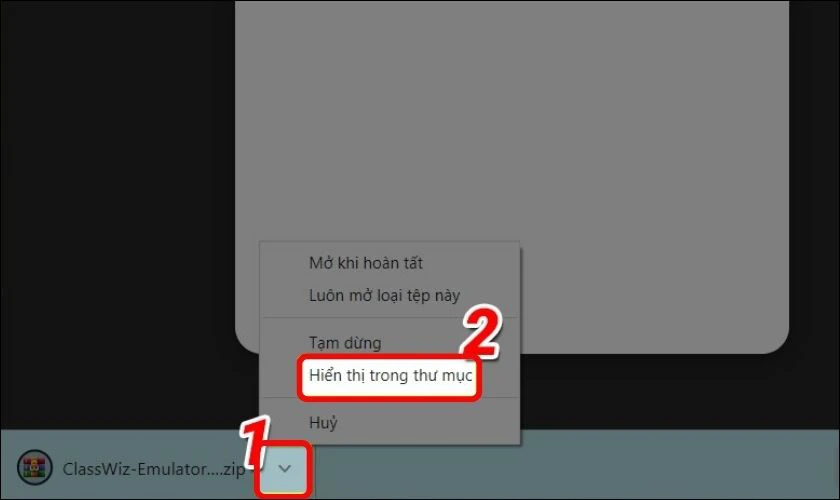 Khi tải xong file th&igrave; bạn nhấn v&agrave;o mũi t&ecirc;n sau đ&oacute; chọn hiển thị trong thư mục