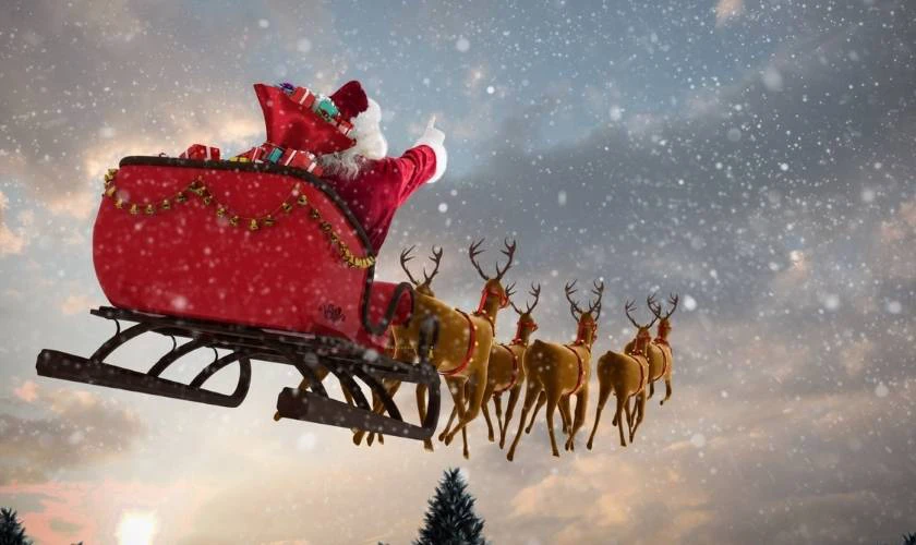 &Ocirc;ng gi&agrave; Noel l&aacute;i xe trượt cỏ cưỡi tuần lộc để đi ph&aacute;t qu&agrave;